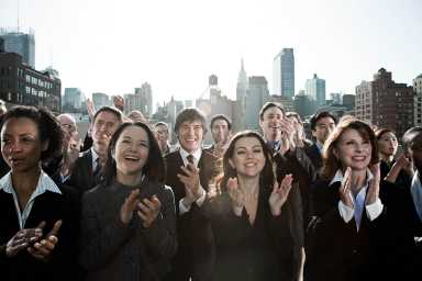 Business people clapping