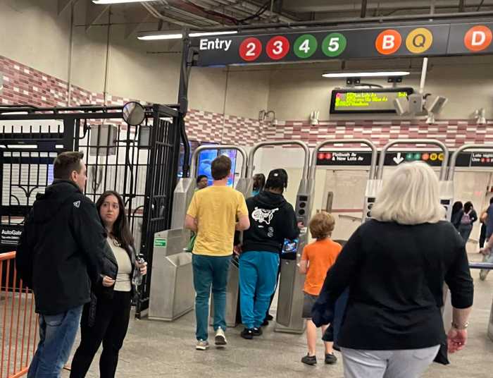 MTA sets hybrid public hearing schedule for proposed fare/toll hikes without sessions in outer boroughs 4 People paying fare at a turnstile in Brooklyn