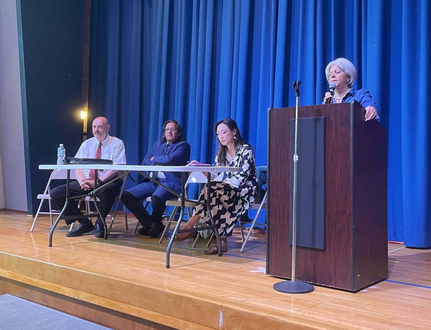 THE COSTS OF CHANGE, Part 2: Some relief available for NYC co-ops and condos as they approach year-end deadline for climate law upgrades 9 Vickie Paladino at the podium