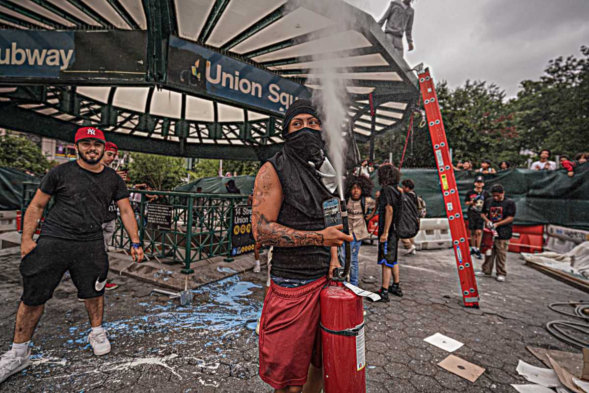 Riot breaks out in Union Square on Friday, Aug. 4. One man sets off fire extinguisher.