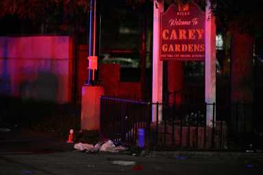 A cone marks an evidence marker after a man was shot in the head outside of Brooklyn's Carey Gardens House on Saturday night.