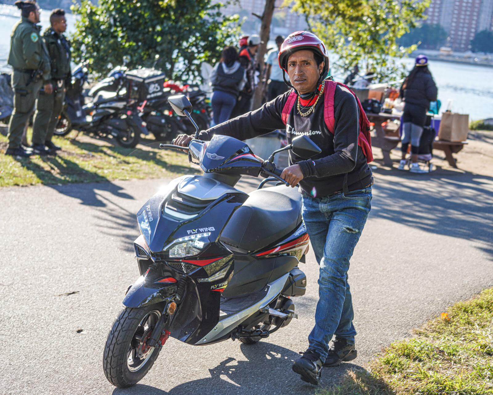 Illegal migrant-run market on Randall's Island busted, cops confiscate scooters near emergency shelter 10 migrant clings to his scooter