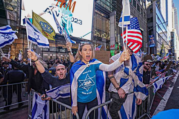 Editorial | Now is the time for all Americans to defend democracy in Israel, Ukraine and America 3 Israel supporter at protest holding American flag