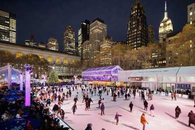 Bank of America Winter Village at Bryant Park to open for the season on Friday 6 Skaters on the ice skating rink at night at Bank of America Winter Village at Bryant Park.