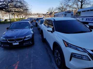 Double parked cars in era of congestion pricing and need for parking permits