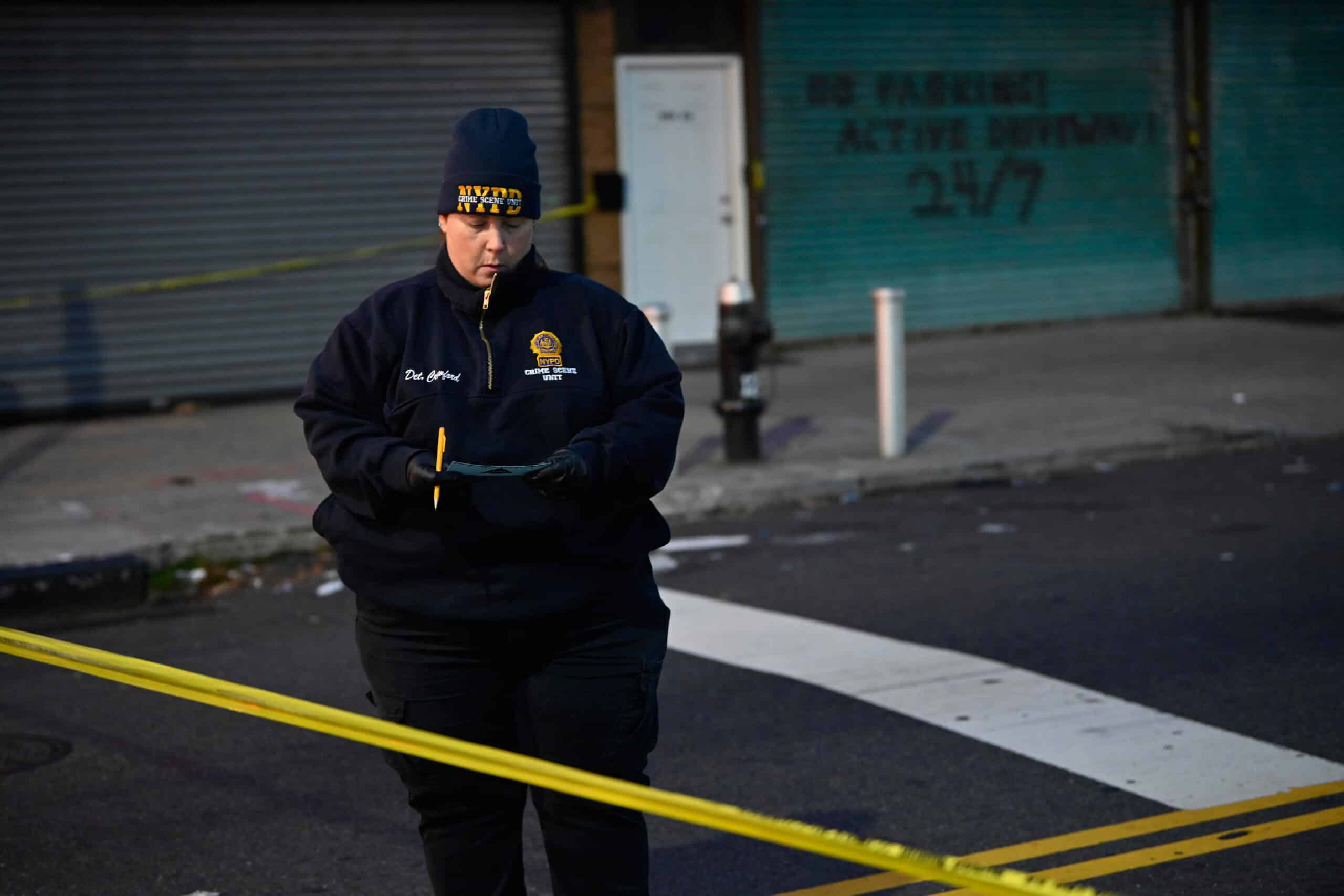 Queens double shooting mystery: Woman killed, man injured in hail of bullets, police say 4 A Crime Scene Detective carries an evidence ticker at the scene of a fatal shooting at 127 Street and Liberty Avenue