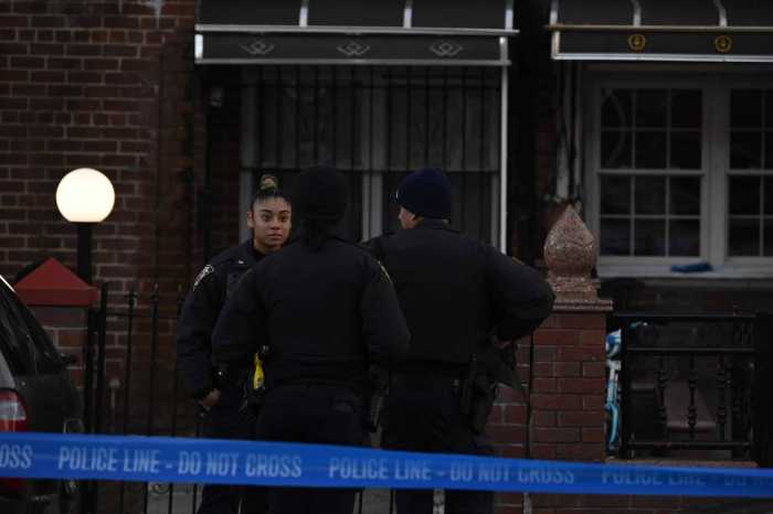 Brooklyn shooting leaves woman injured; male suspect on lam, police say 4 Police outside Brooklyn home following shooting