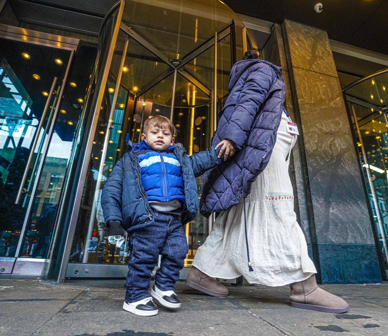 Migrant evictions begin with pregnant women, children forced out of hotel as Lander announces investigation into 60-day shelter cap 14 sullen and concerned, families wandered into an uncertain future