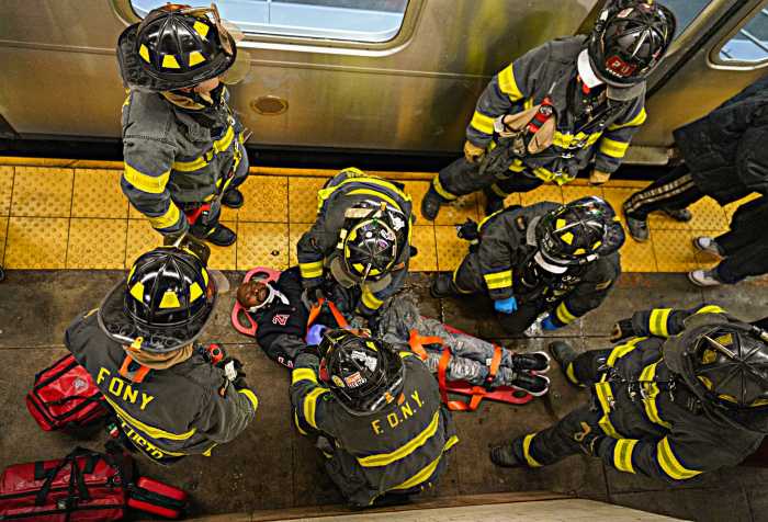 J train strikes and injures man on platform of Lower Manhattan subway station: MTA 3 Firefighters help man struck by J train in Lower Manhattan