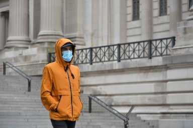 Mask mandate back at NYC public hospitals amid winter COVID surge 7 Man wearing mask amid COVID outbreak