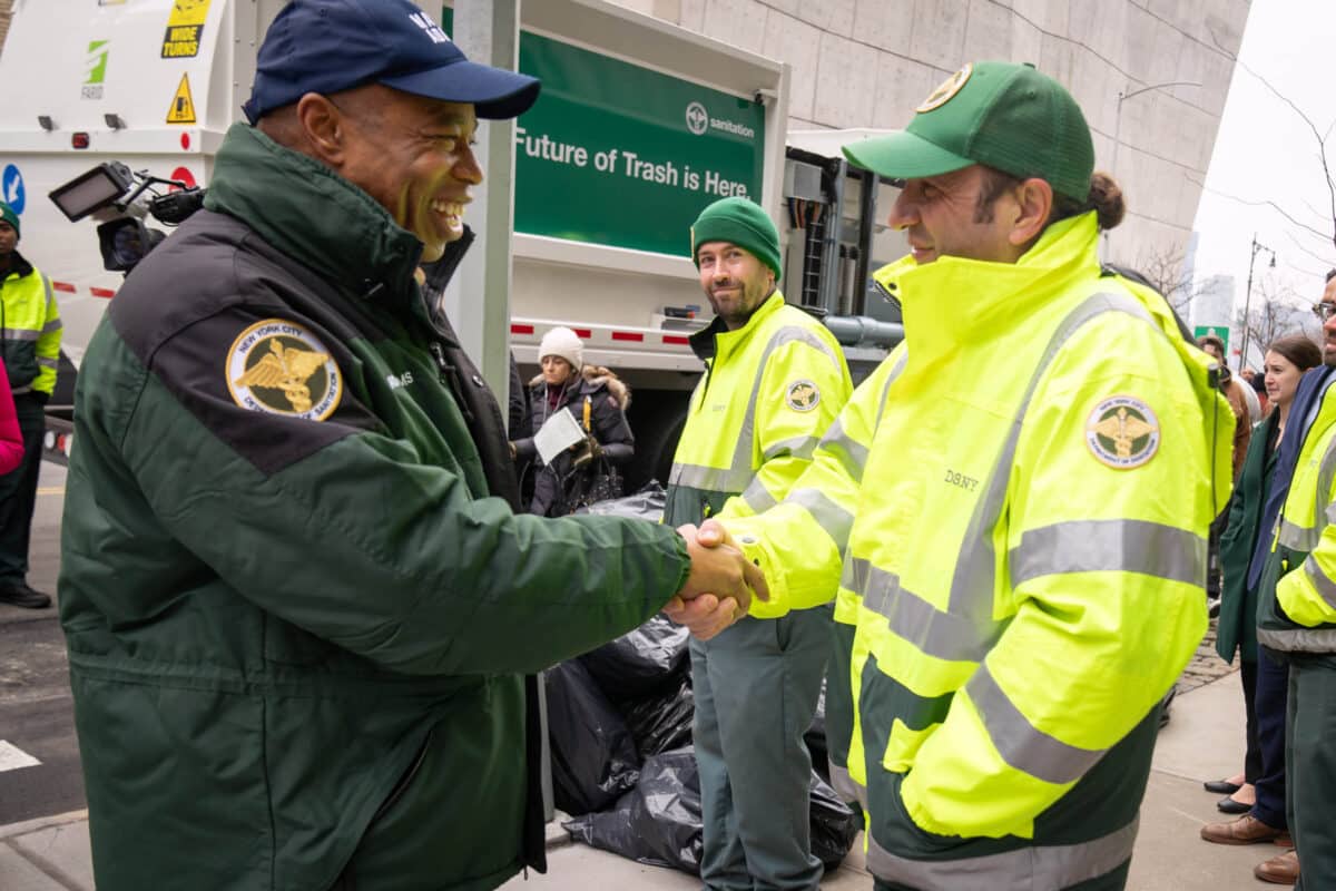 Side-loading garbage trucks intro'd as 'superweapon' against big piles of NYC trash bags: Mayor Adams 5 Mayor Adams and reporter with trash container