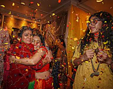 Through a blitz of color and goodwill they chanted in honor of Holi
