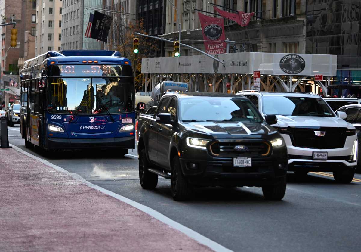 An M31 bus sits in traffic on 57th Street in Manhattan on Dec. 14, 2023.