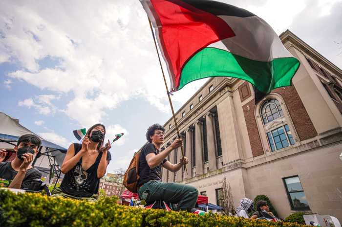 Columbia University cancels school-wide commencement ceremony after protests 4 Protester at Columbia University waves Palestine flag