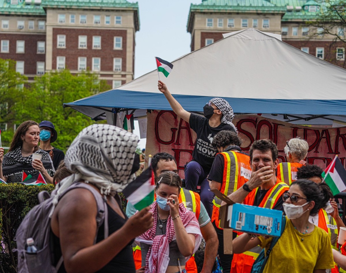 Not budging: Columbia University protesters refuse to end encampment despite admin threats of suspension 10 Faculty and staff interlocked their arms and formed a human barricade at the entrance to the tent site.