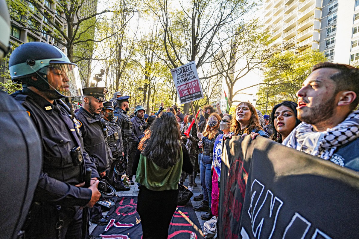 Interlocking arms, the students came face-to-face with officers in riot gear
