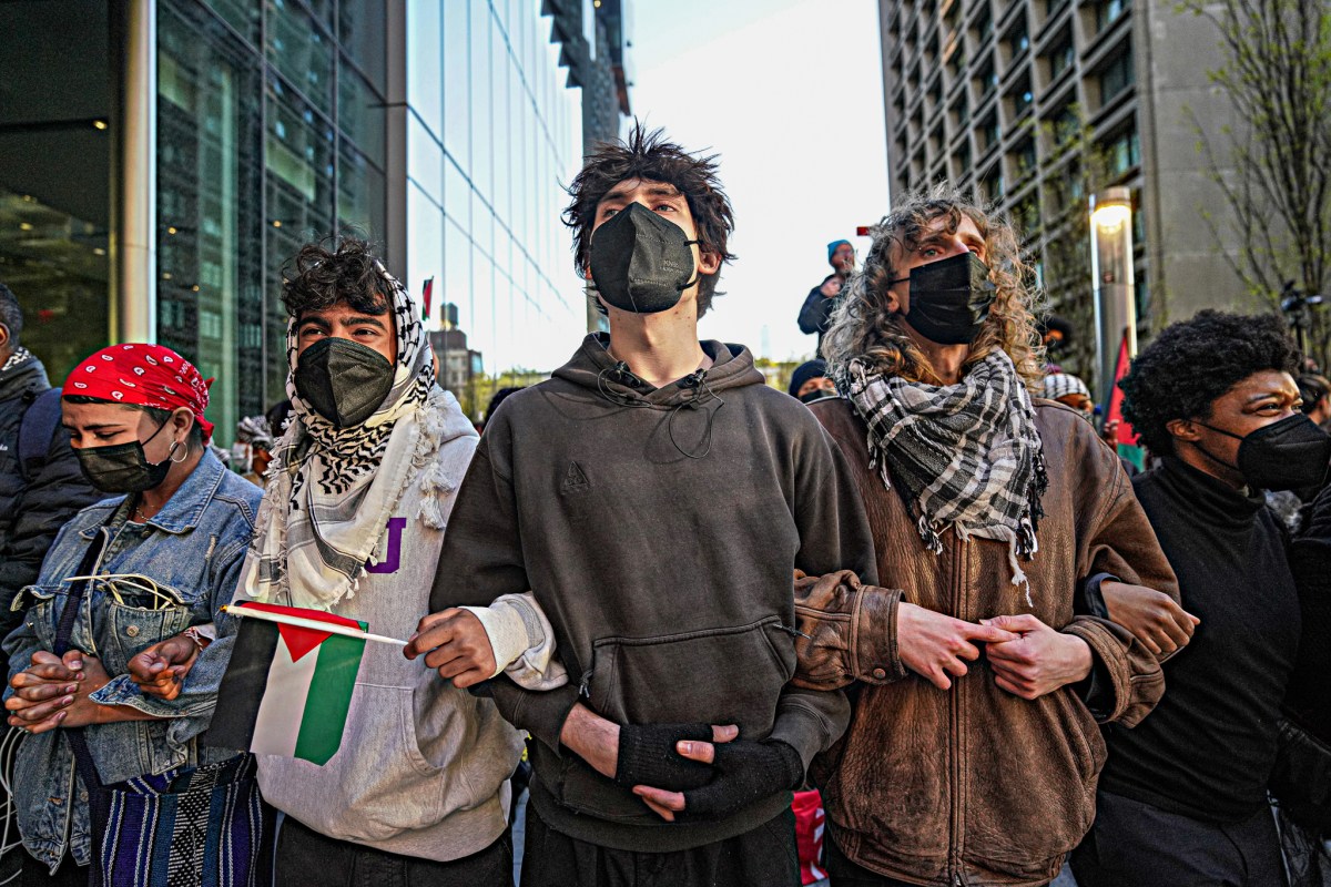 Interlocking arms, the students came face-to-face with officers in riot gear