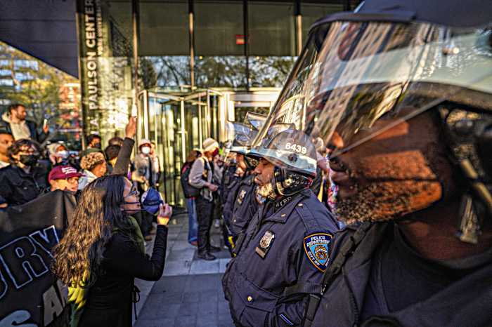 NYU students re-erected an encampment outside the college on Friday after having their original demonstration raided by police earlier in the week and were instantly met with a tense face-off by riot cops.