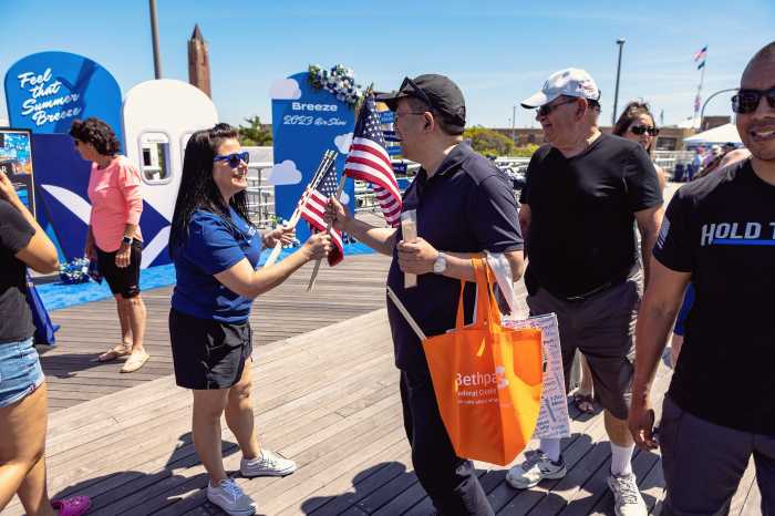 A men and women holding USA flag
