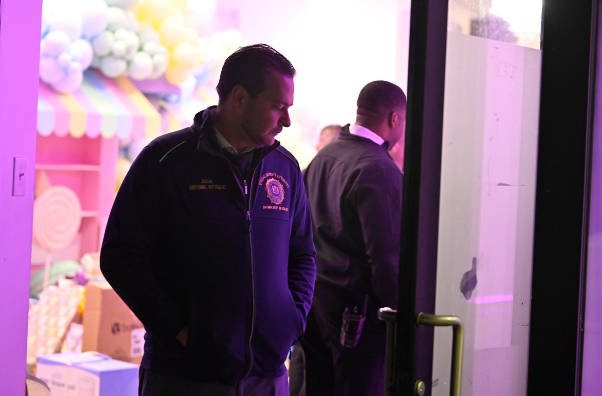 Queens baby shower shooting: Police identify murder victim as search continues for killer who wounded three others 6 Queens law enforcement agent looks at shooting scene