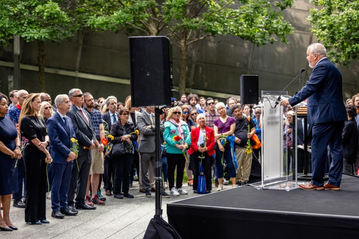 speaker at a podium talking to a crowd