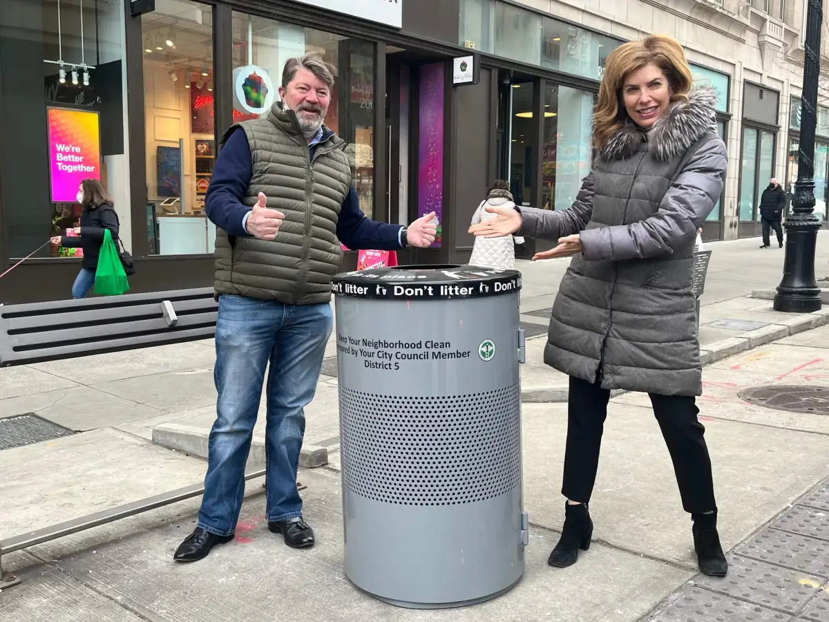 Scoop the poop! How a City Council bill aims to make dog-waste bags available for free to New York dog owners 3 Two people with NYC street trash basket