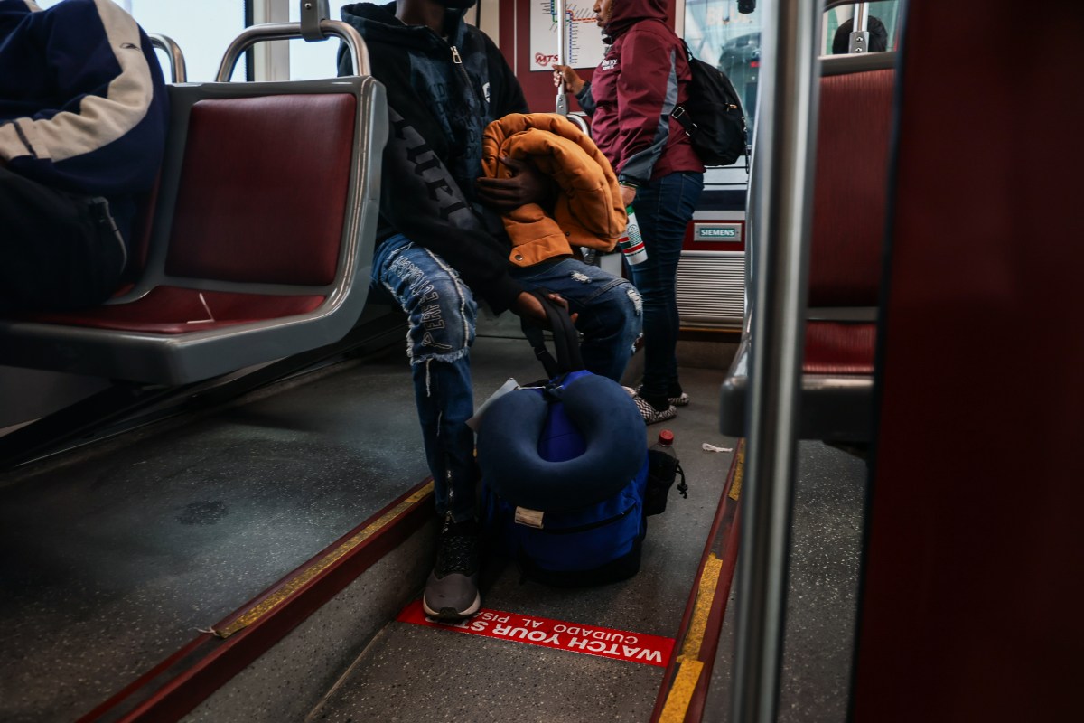 From the border to the Big Apple: One migrant's journey through hardship for asylum 9 Adoum sits on a bus in California.
