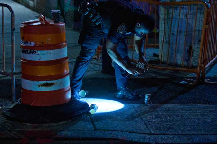 Manhattan teenager shot in face at apartment building; suspect still on the lam, cops say 3 Police search for evidence after shooting