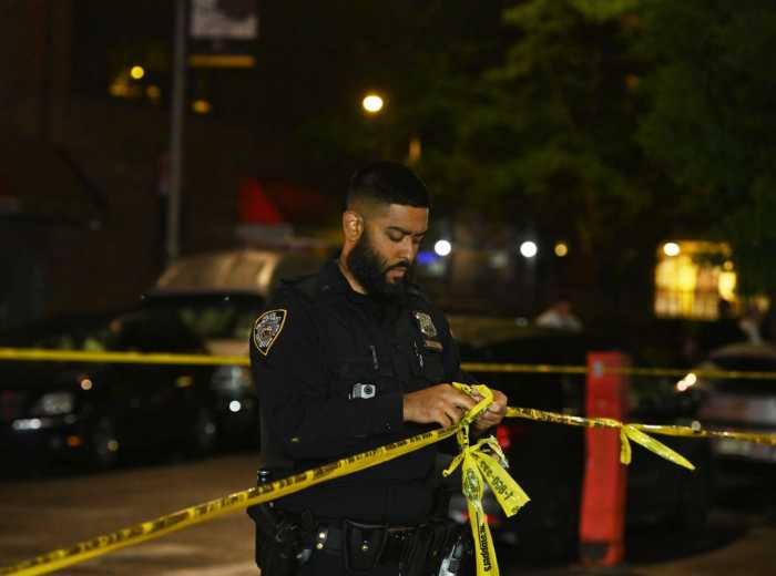 Bronx double stabbing near shopping plaza leaves two men dead: NYPD 2 Police officer with crime scene tape