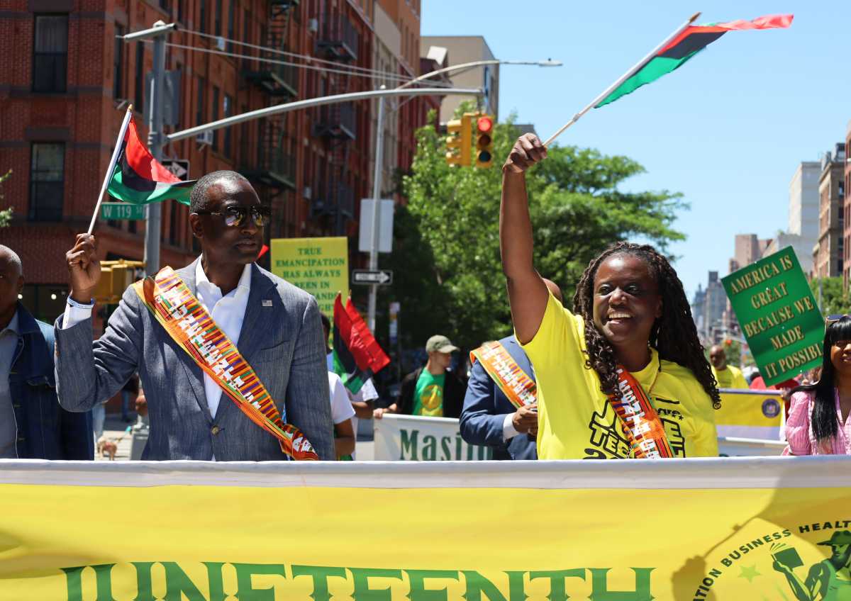 New York State Senator, Cordell Cleare and City Council Member, Yusef Salaam lead the parade
