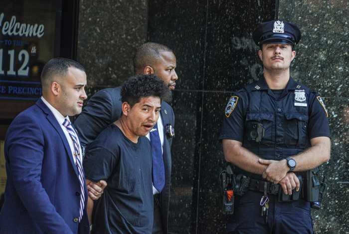 Suspected Queens park rape suspect escorted by detectives during perp walk