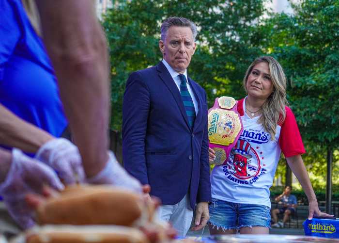 Nathan's Hot Dog Eating Contest competitors set to feast for glory without Joey Chestnut 7 Host George Shea (left) and women’s champion Miki Sudo.