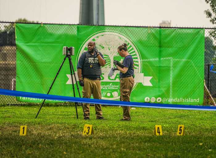 Triple shooting near Randall's Island migrant shelter leaves one dead: cops 14 Police at crime scene