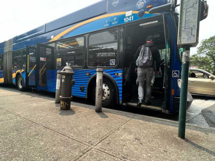 A straphanger boards a Bx36 bus in the Bronx.