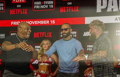 Mike Tyson and Jake Paul have a shoving match.