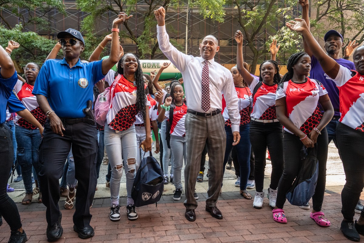 NYPD hosts Back-To-School-Bash at 1 Police Plaza 8 Det. Michelle Jones (left) and Deputy Commissioner Mark Stewart (middle) practiced their soca moves.