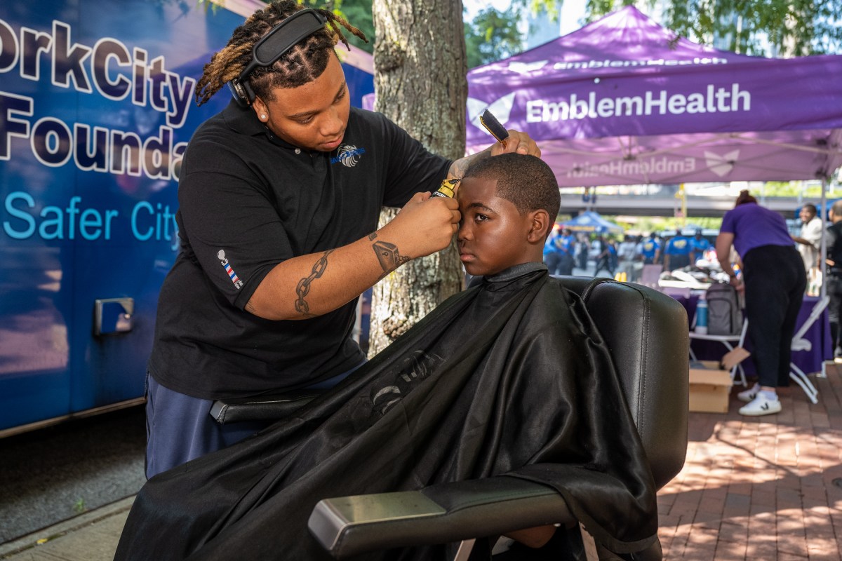 NYPD hosts Back-To-School-Bash at 1 Police Plaza 4 Eagle Barber, part of Eagle Academy's CTE program, provided free hair cuts.