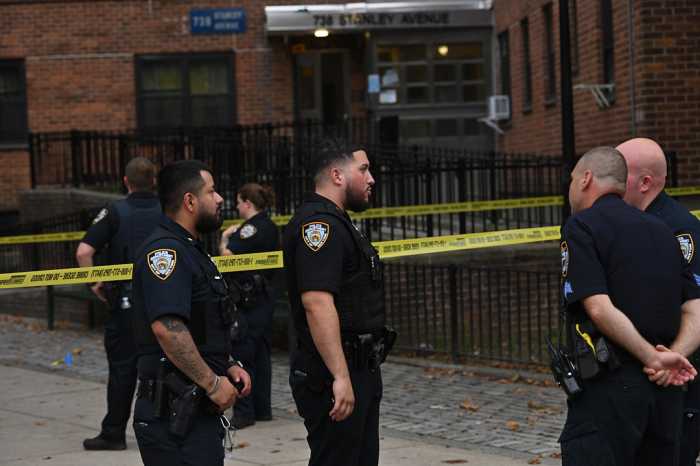 Bronx double shooting on Easter Sunday leaves one man dead, another hospitalized 3 police in uniform by caution tape in the Bronx
