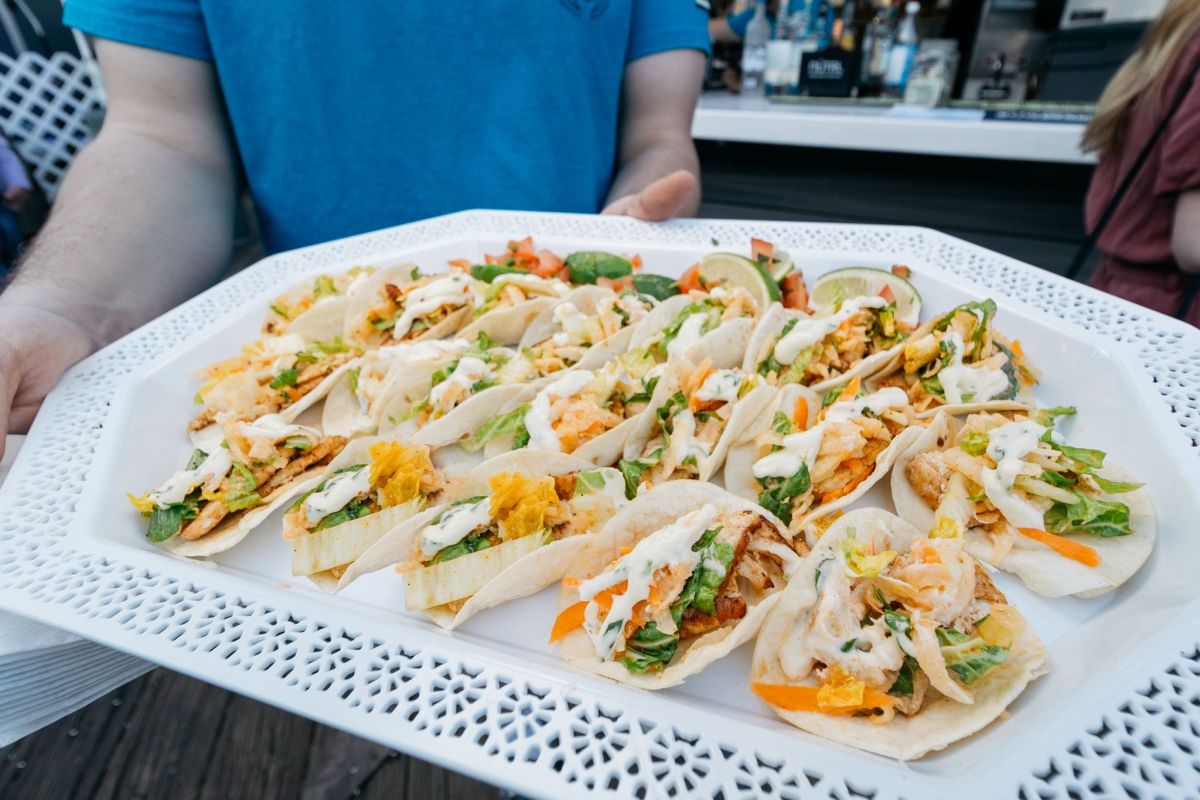 Cobble Fish keeps the spirit of the Seaport alive with hometown vibes and seaside eats 2 fish tacos on a platter