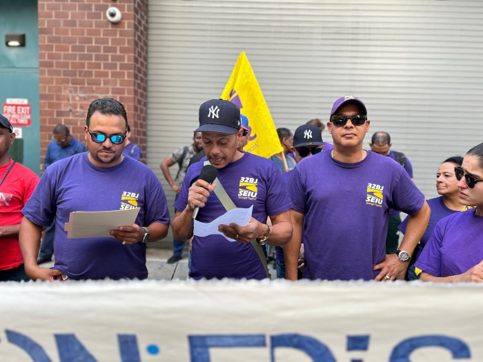 workers at Con Ed speak at an oudtdoor rally