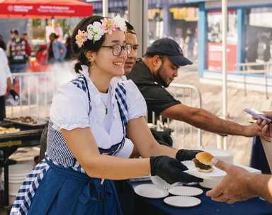 Taste of the Seaport Returns 26 a women serving food