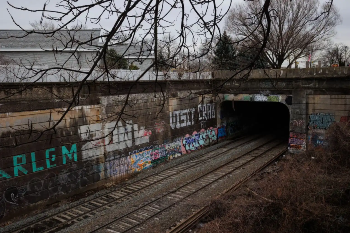 The freight tracks of the Bay Ridge Branch, where the Interborough Express would run, and a contentious tunnel the MTA says is too narrow to run trains through.