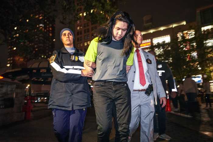 East Village subway stabbing suspect caught with several knives on him, cops say 2 East Village subway stabbing suspect in handcuffs, escorted by detectives