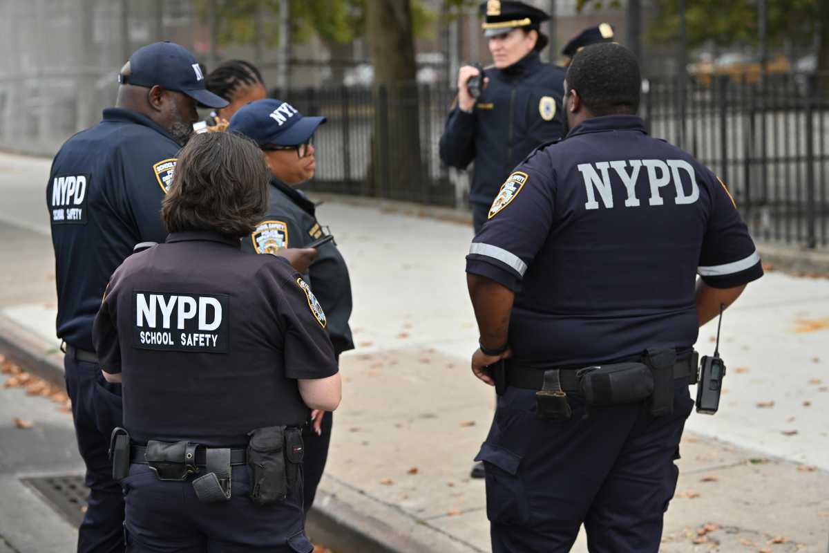 NYPD officers at a Queens crime scene