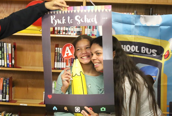 New York Cares hosts back to school backpack giveaway at P.S. 171 2 Parents were able to participate in fun activities at the giveaway, including photo ops.