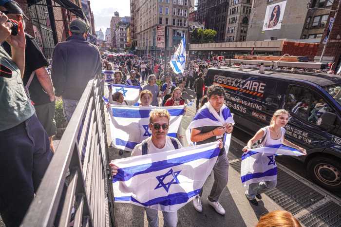 A group of pro-Israel demonstrators march near the pro-Palestine demonstration in Union Square on Oct. 7, 2024.