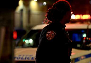 A police officer at a Brooklyn shooting scene