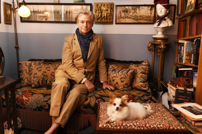 Peter McGough in his West Village apartment, with Queenie