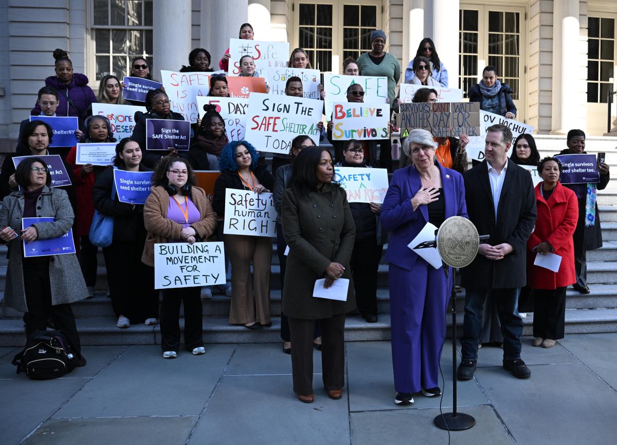 Liz Roberts (center) addresses the crowd.