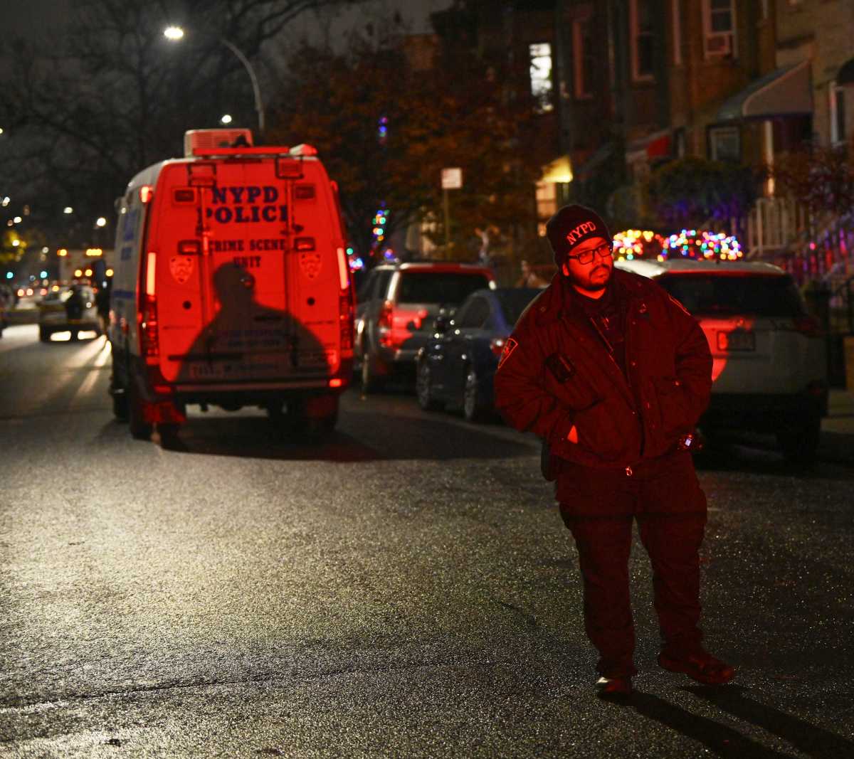 An officer from the 67th Precinct guards the scene of a fatal shooting at 131 East 32 St. in East Flatbush, Brooklyn on Dec. 9, 2024.